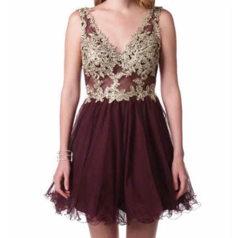 Beautiful dress with rhinestones and gold detail!